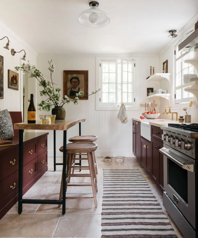 A Cottage Kitchen That Blends Storage and Seating